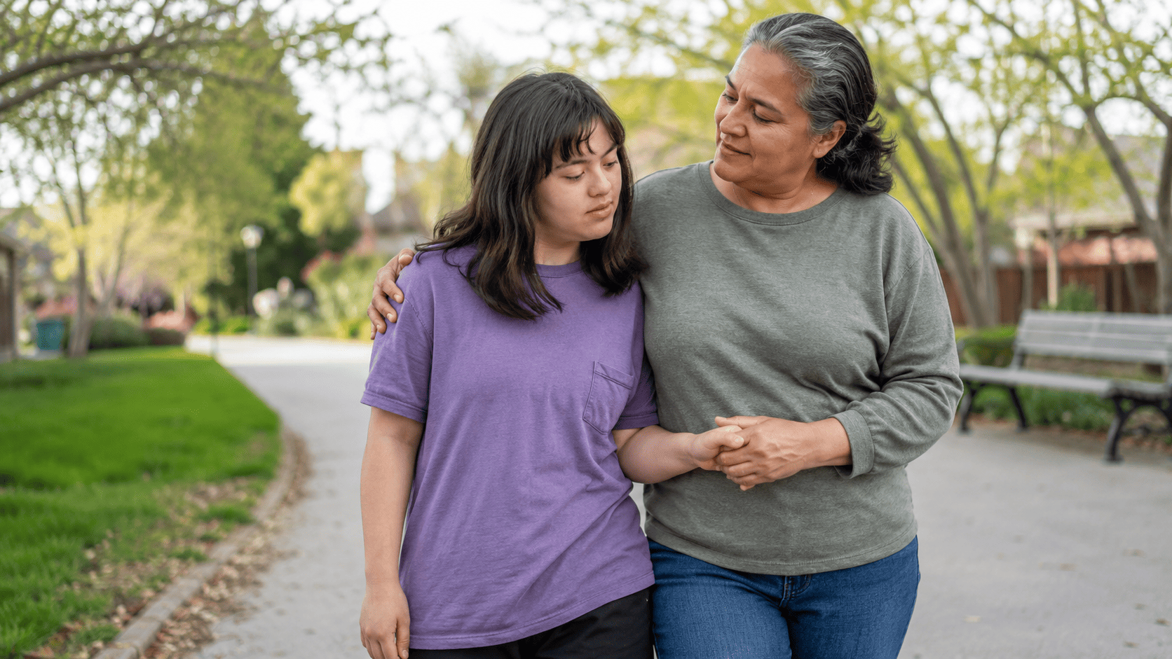 Mother walking with her adult daughter with a disability