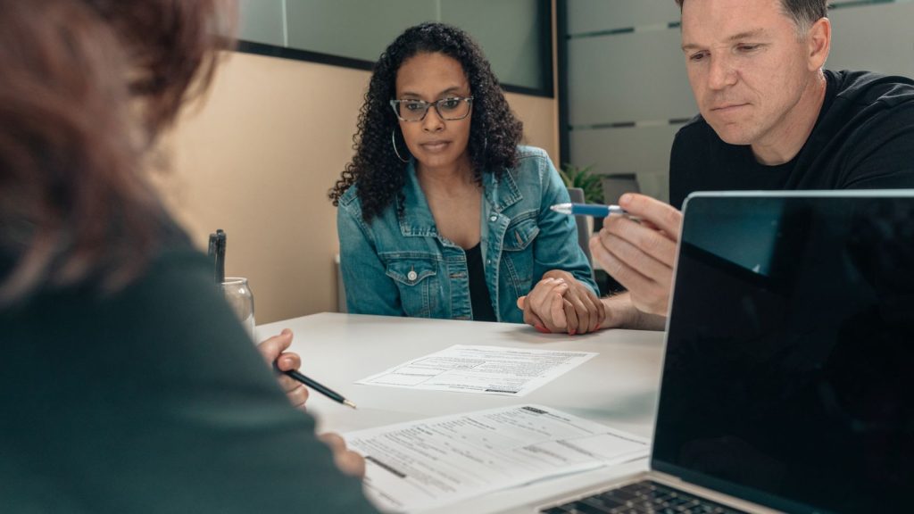 Parents reviewing Special Needs Trust documents with an advisor in Massachusetts
